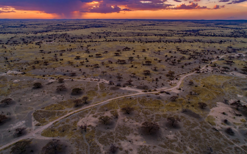AI-composed aerial scene of the Sahel landscape at dusk illustrating the Niger security forces killed attacks in western Niger
