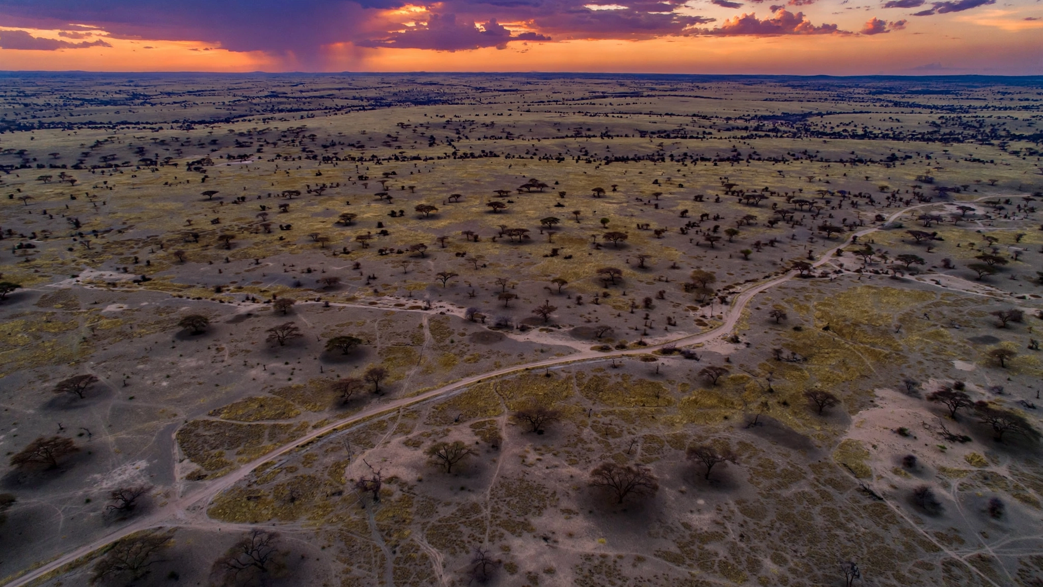 AI-composed aerial scene of the Sahel landscape at dusk illustrating the Niger security forces killed attacks in western Niger