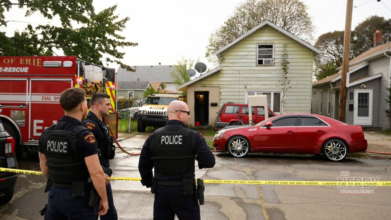 Erie police officers and firefighters outside the home on Perry Street in Erie, Pennsylvania, during the Erie mass shooting investigation