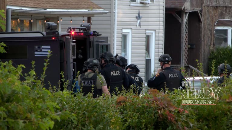 SWAT and Erie police officers gathered outside the Erie mass shooting scene on the evening of October 9, 2026