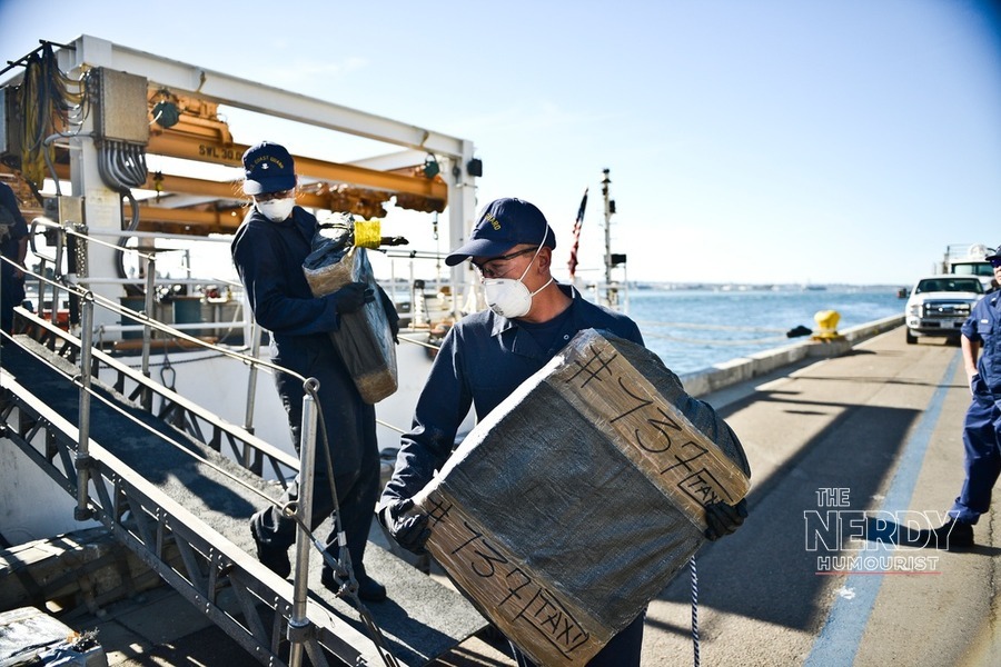 U.S. Coast Guard personnel offload bales of seized cocaine from an Eastern Pacific drug-trafficking interdiction.