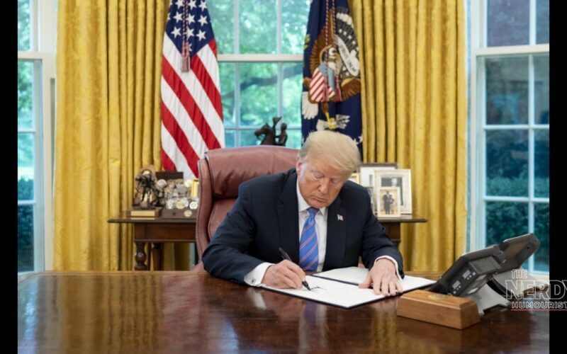 President Donald Trump signs an executive order at the Resolute Desk in the Oval Office, ahead of coverage of the trump marijuana rescheduling executive order