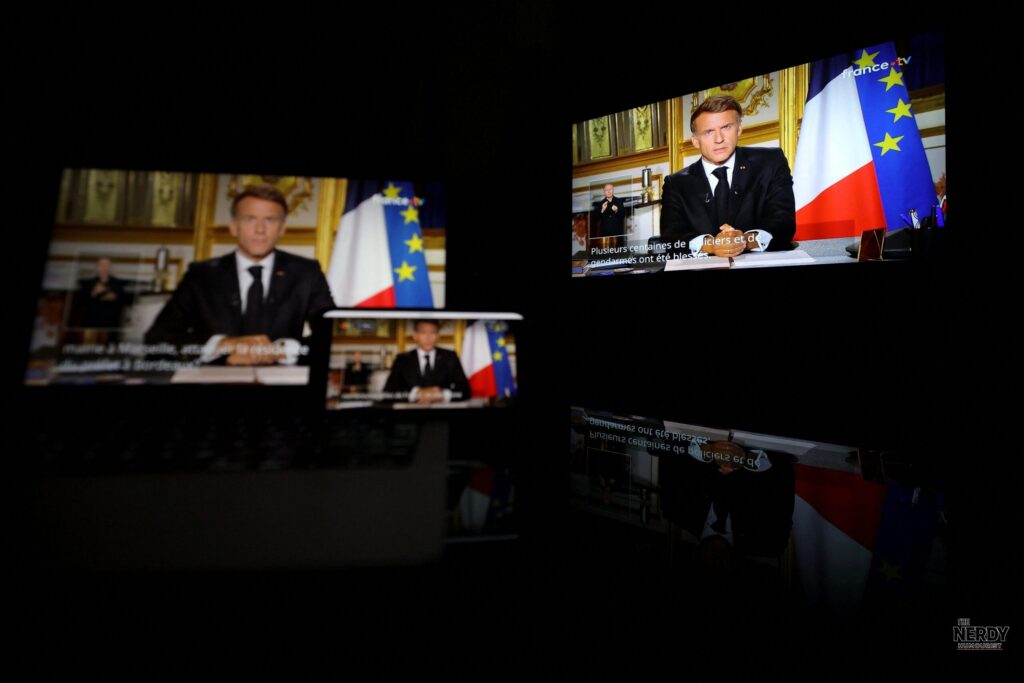 Emmanuel Macron seen on television during his Oct 18 address condemning violence at the France protests