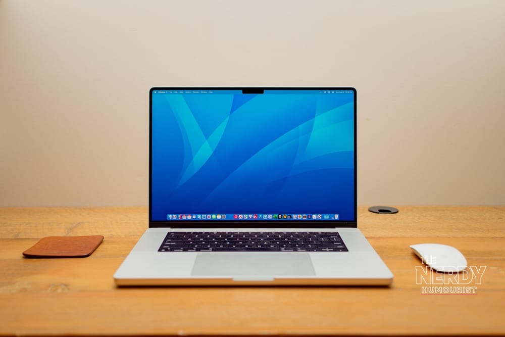 MacBook Pro showing macOS on a desk — Apple macOS Full Disk Access AI agents policy change means granting the permission will need more explicit user action