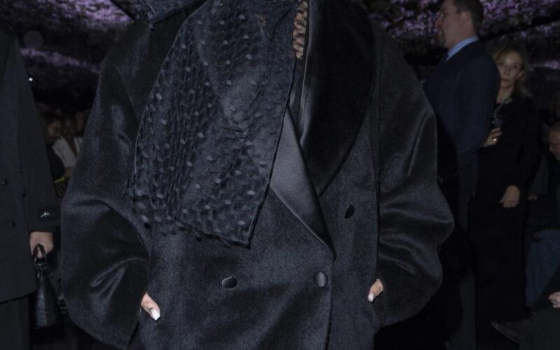 Rihanna attends a Dior show in Paris, at the center of the Rihanna EJ Johnson Dior Paris Fashion Week controversy