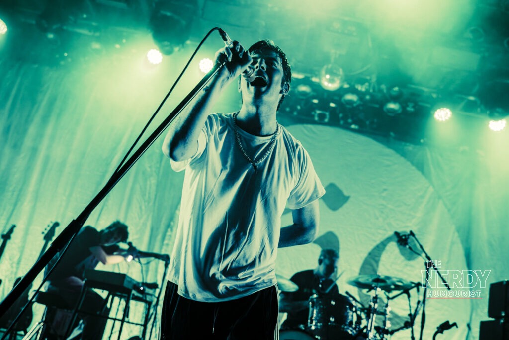 Grian Chatten singing live on stage during the Fontaines D.C. Dopamine Chamber tour cycle