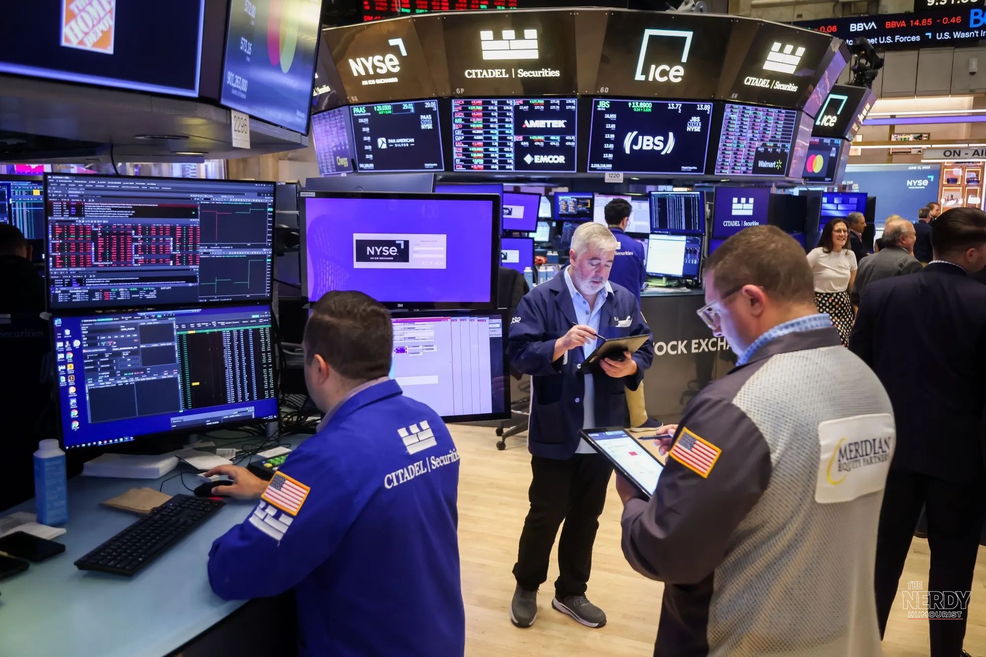 Traders at work on the New York Stock Exchange floor as mixed big bank earnings 2026 results land amid market volatility