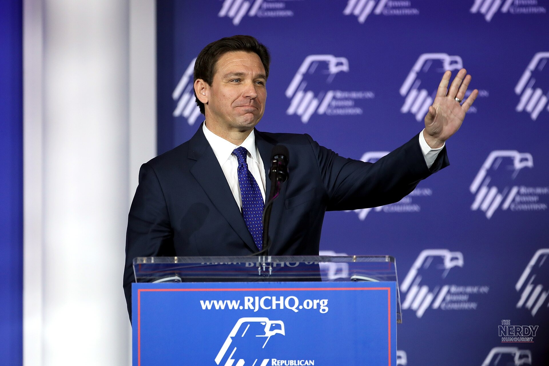 Gov. Ron DeSantis speaking at a podium after signing the state of emergency ahead of Tropical Depression Nine Isaias (file photo)