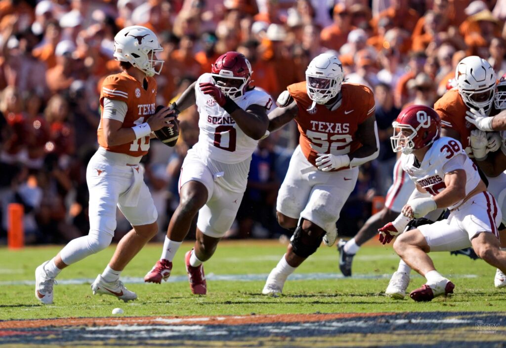 Arch Manning drops back for Texas against Oklahoma in the Oklahoma Texas Red River Rivalry at the Cotton Bowl.
