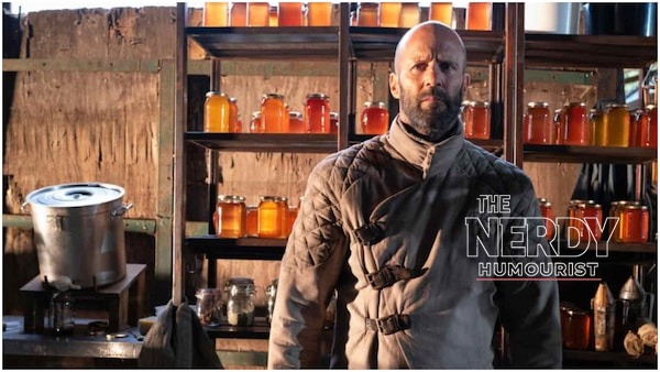 Jason Statham as Adam Clay in his beekeeper suit in The Beekeeper
