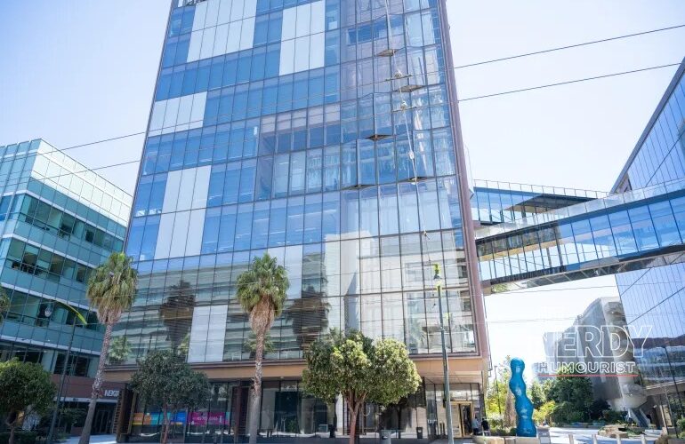 Modern glass office towers associated with OpenAI as eight US states sue the company over claims ChatGPT harms children