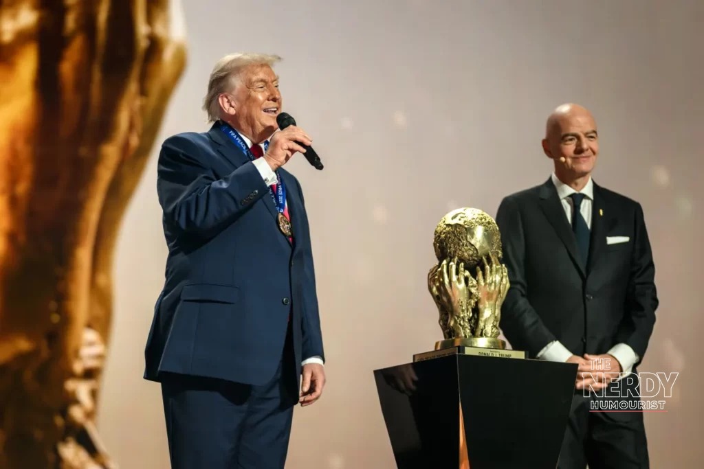 Trump wearing the FIFA Peace Prize medal after receiving the inaugural award from Gianni Infantino at the World Cup draw ceremony