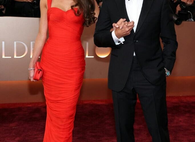 George and Amal Clooney on a red carpet (file photo), as the George Clooney Presley Gerber death story broke at the Albies