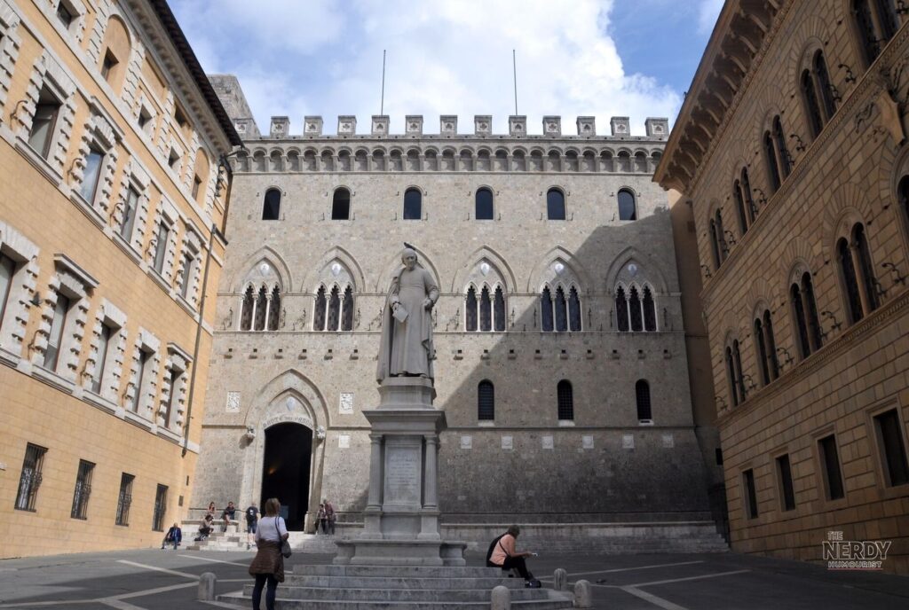 Banca Monte dei Paschi di Siena headquarters at Piazza Salimbeni in Siena; its $32 billion bid for Banco BPM led global M&A Q3 2026 megadeals