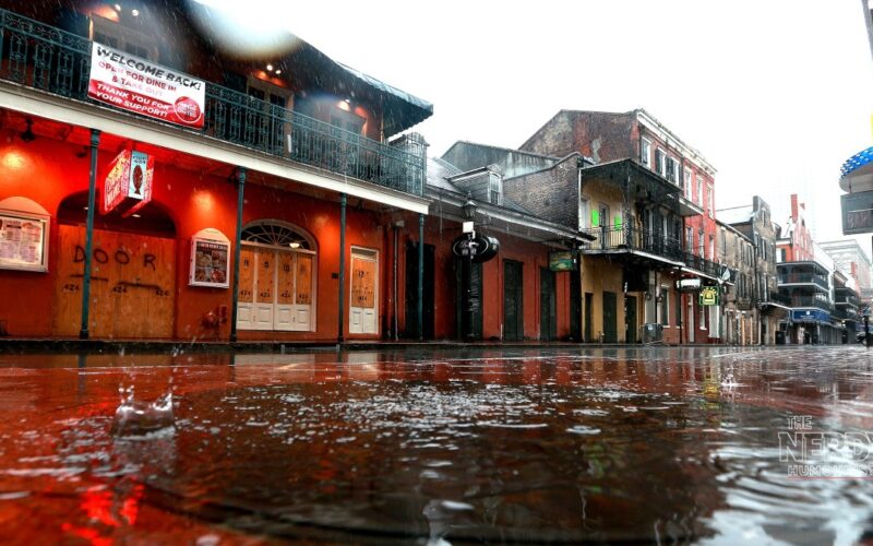 Rain floods a New Orleans street as the Gulf Coast flash flood threat storms system soaks the city