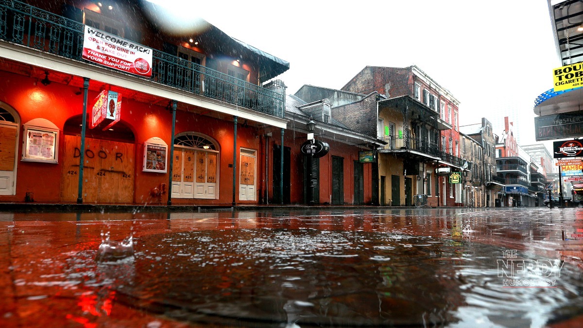 Rain floods a New Orleans street as the Gulf Coast flash flood threat storms system soaks the city