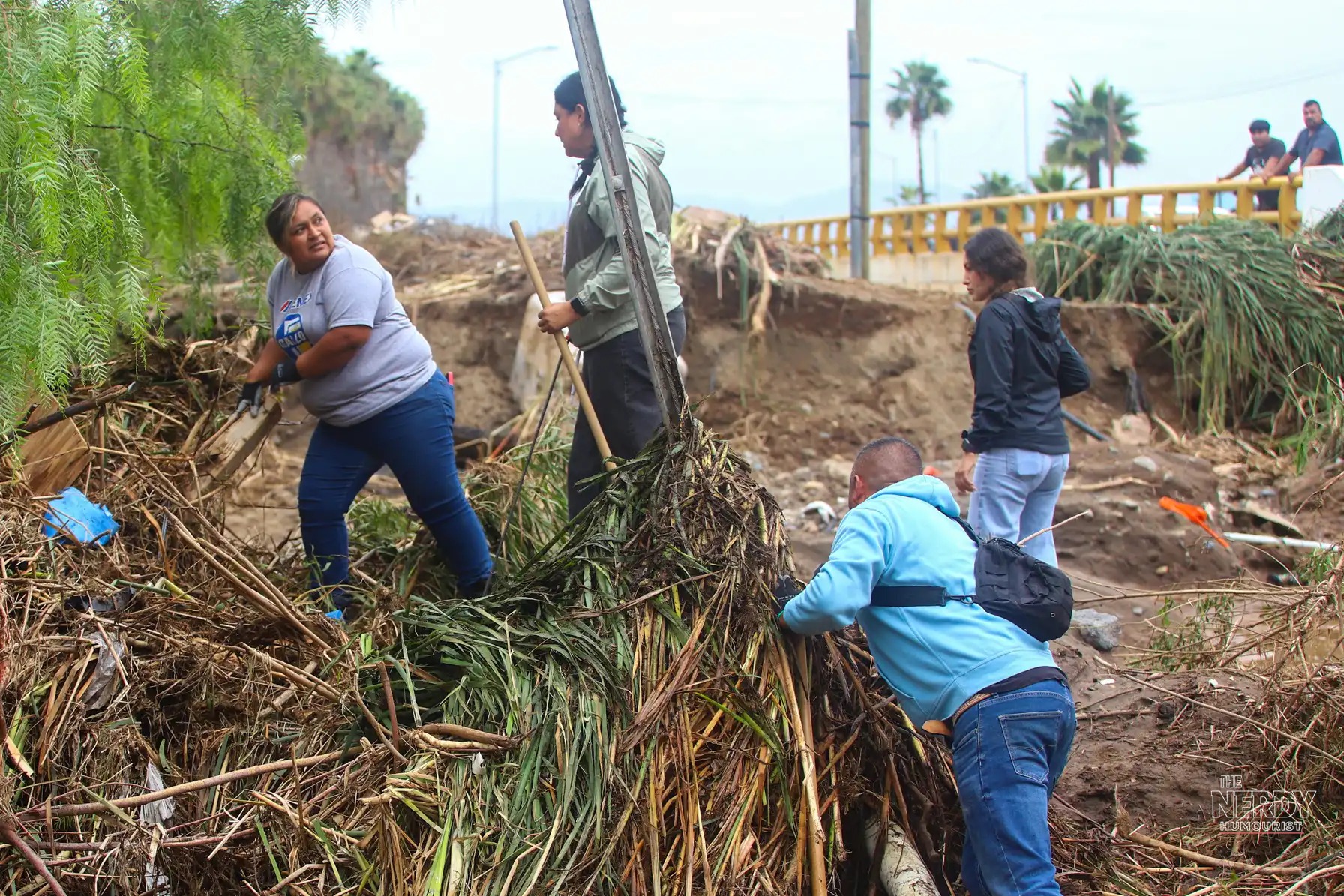 Residents clearing debris in Ensenada, Baja California, after the Hurricane Simon Mexico floods and Tropical Storm Rachel's remnants