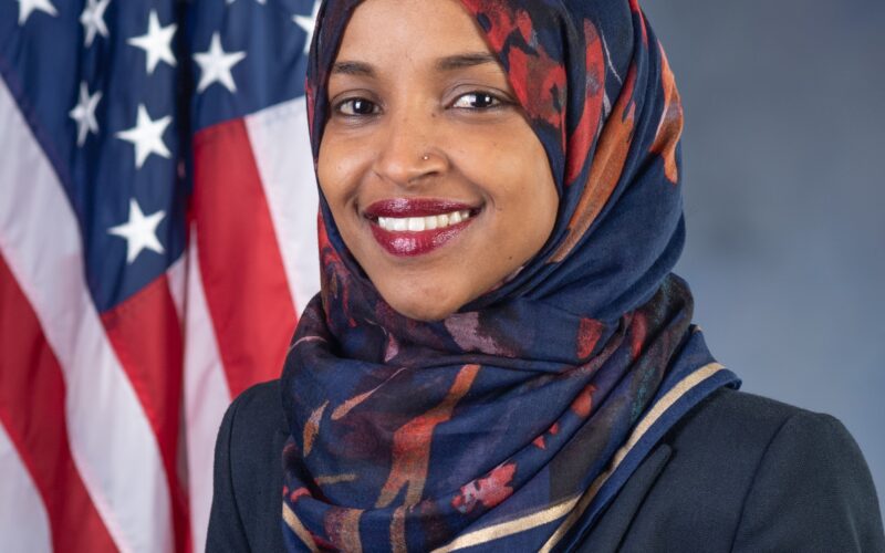 Official portrait of Rep. Ilhan Omar, at the center of a federal criminal investigation with her phone seized and relatives subpoenaed
