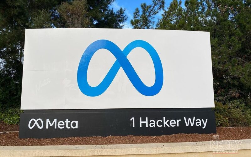 Meta headquarters entrance sign at 1 Hacker Way in Menlo Park, California