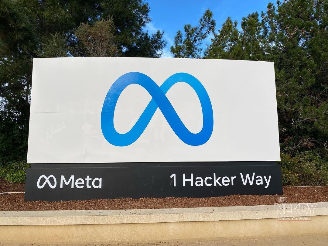Meta headquarters entrance sign at 1 Hacker Way in Menlo Park, California