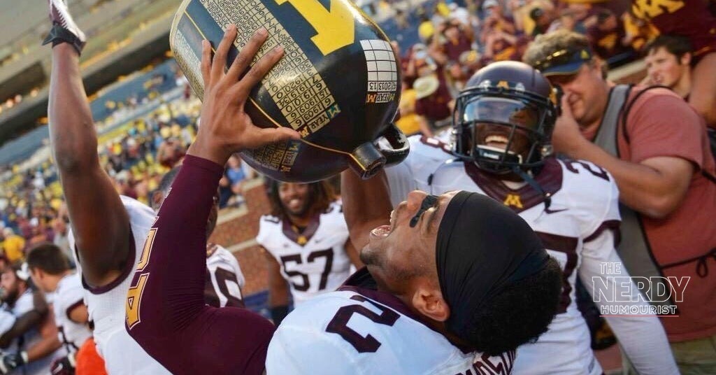 Minnesota Gophers fans celebrate the 20-14 upset win over Michigan in Minneapolis
