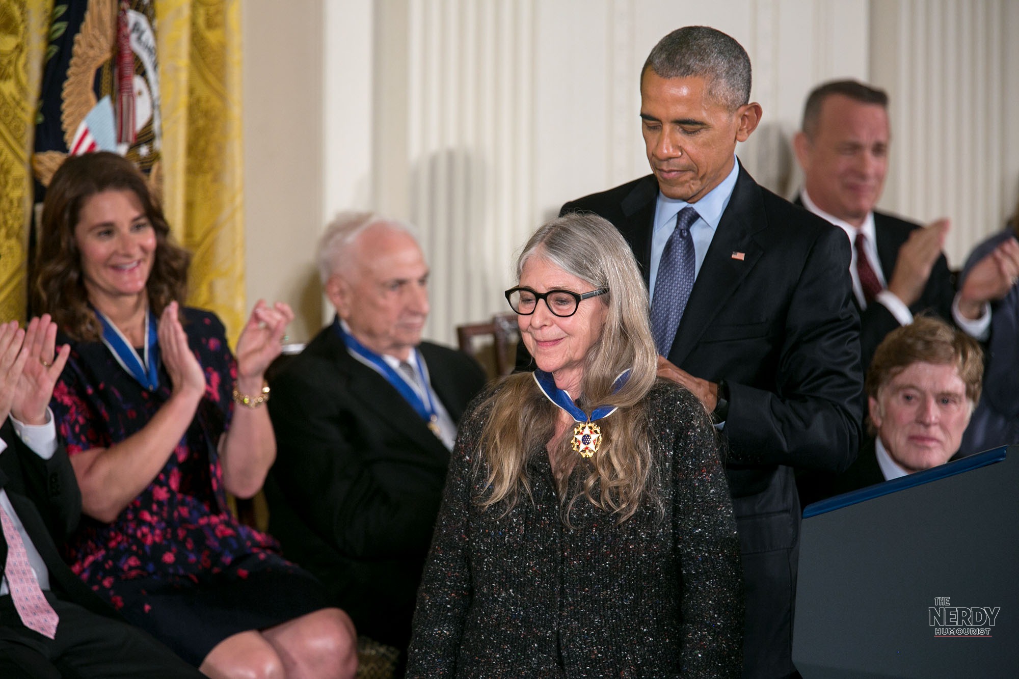 President Barack Obama places the Presidential Medal of Freedom around Margaret Hamilton's neck during the ceremony in the White House East Room on November 22, 2016.