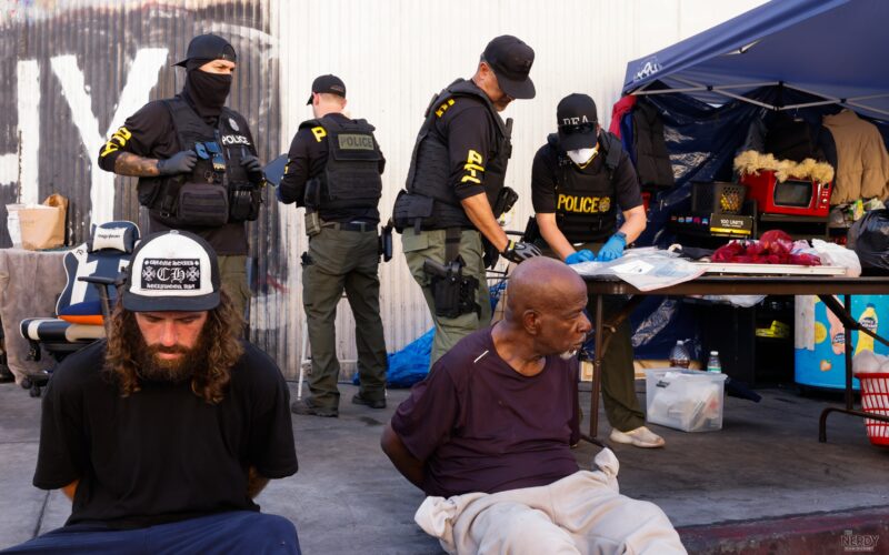 Federal agents from the DEA, LAPD and other agencies search a Skid Row storefront and tent setup during Operation Free Skid Row on Oct 8, 2026, in Los Angeles.