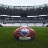 Official NFL 2026 Paris Game football on the Stade de France pitch ahead of the NFL Week 7 schedule opener