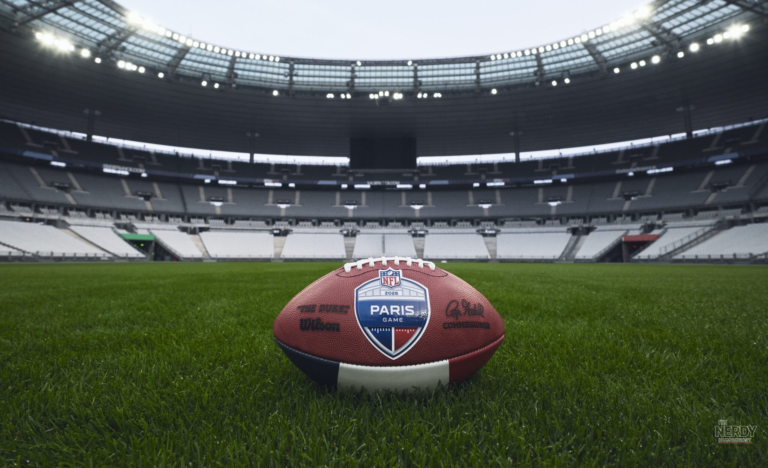 Official NFL 2026 Paris Game football on the Stade de France pitch ahead of the NFL Week 7 schedule opener