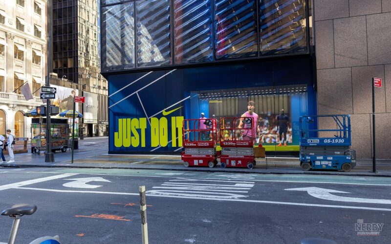Nike flagship storefront in New York City with "Just Do It" signage, as the Nike stock earnings forecast triggers a roughly 8-9% share selloff