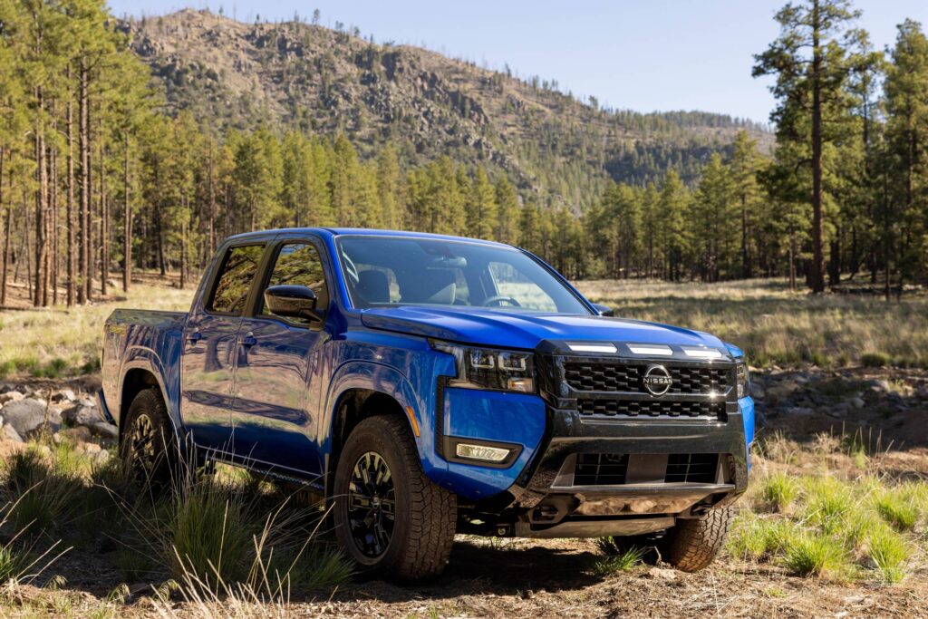 Blue Nissan Frontier pickup truck outdoors amid Nissan Q3 2026 sales growth