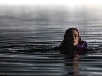 Jane Levy in an official still from the River trailer, treading water at night in the Blumhouse slasher