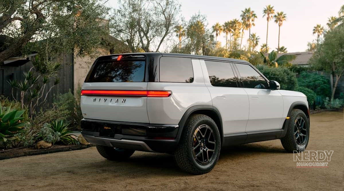 Rear three-quarter view of the Rivian R2 SUV behind Rivian's Q3 deliveries record