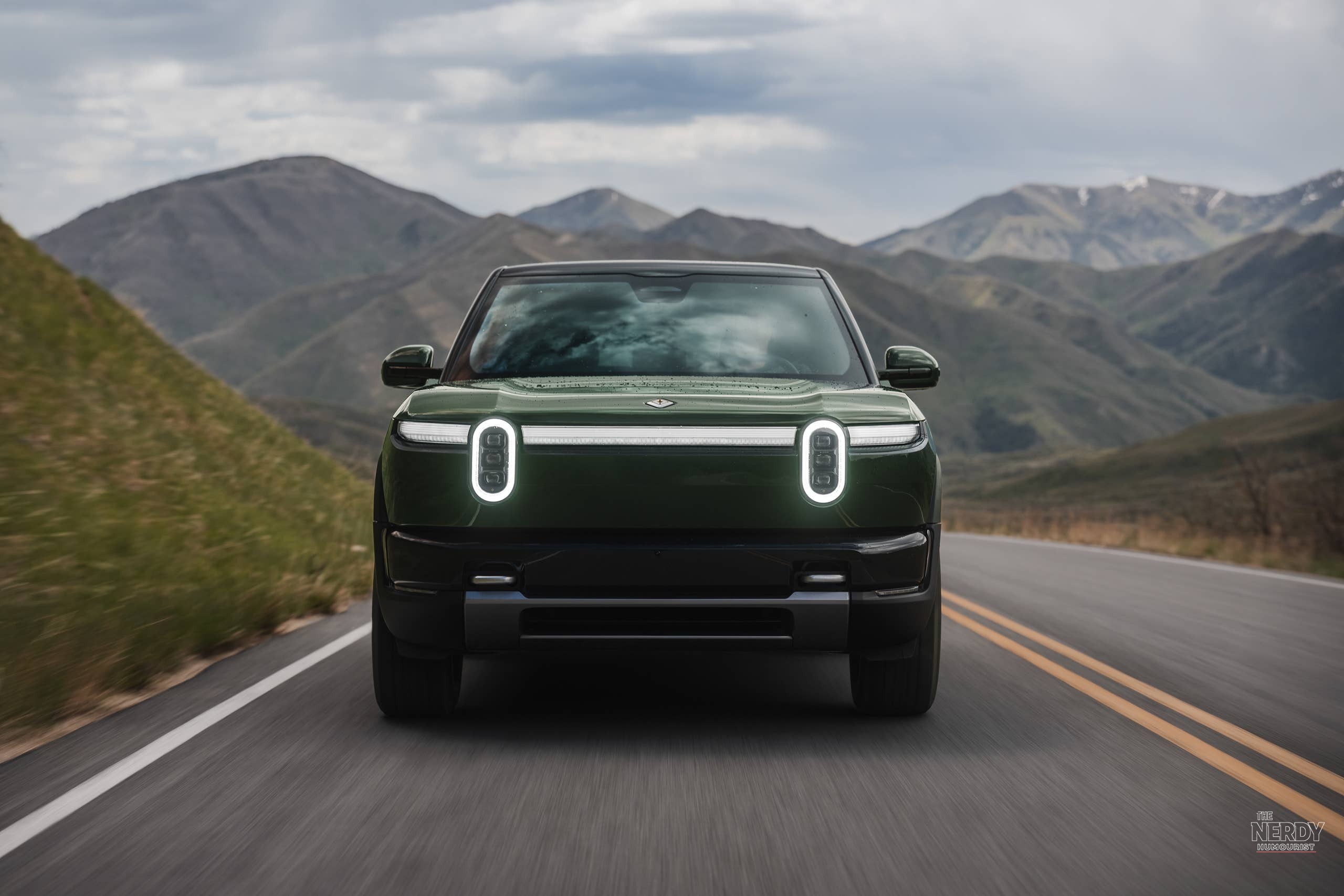 Forest-green 2027 Rivian R2 featured in the Rivian R2 second recall fastener story