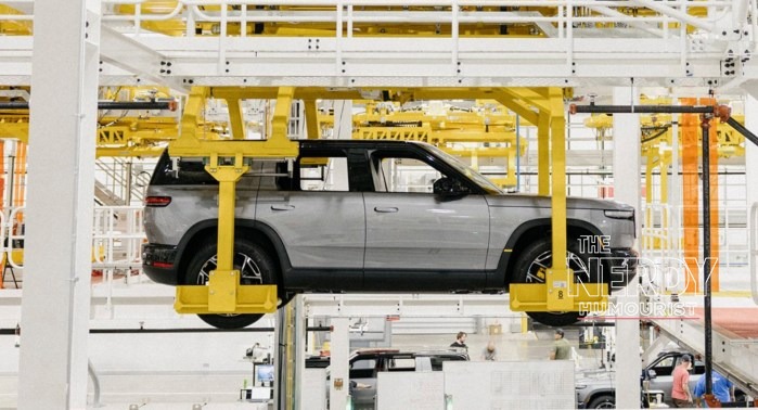 A grey Rivian R2 moving along the production line, the model Rivian is scaling up as the Rivian Volkswagen loan bolsters its funding