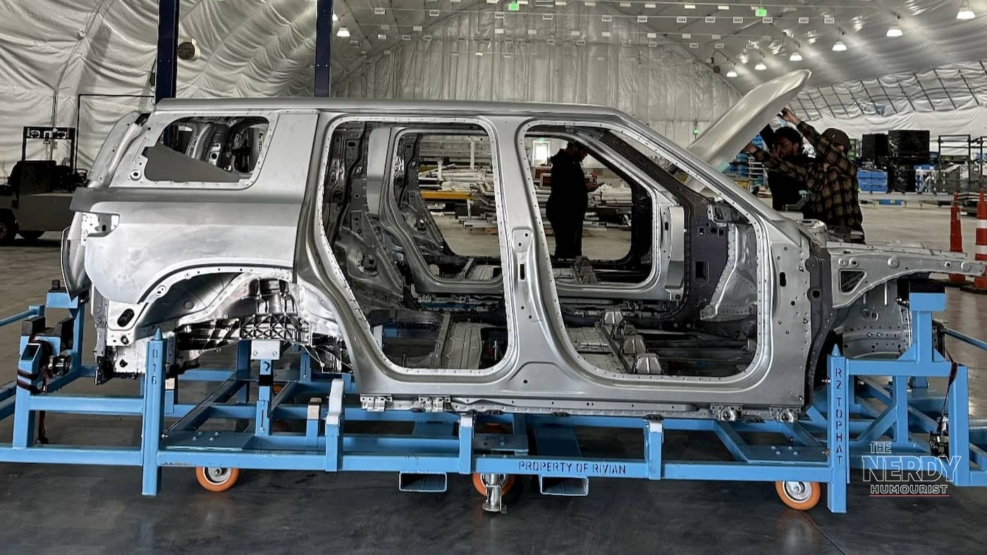 A bare Rivian R2 body shell on an assembly jig at the factory, as the Rivian Volkswagen loan helps fund R2 production