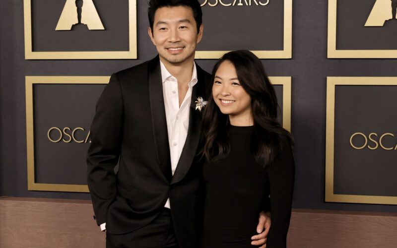 Simu Liu and Allison Hsu posing together on the Oscars red carpet — the couple whose Simu Liu wedding France Allison Hsu news broke Oct. 5
