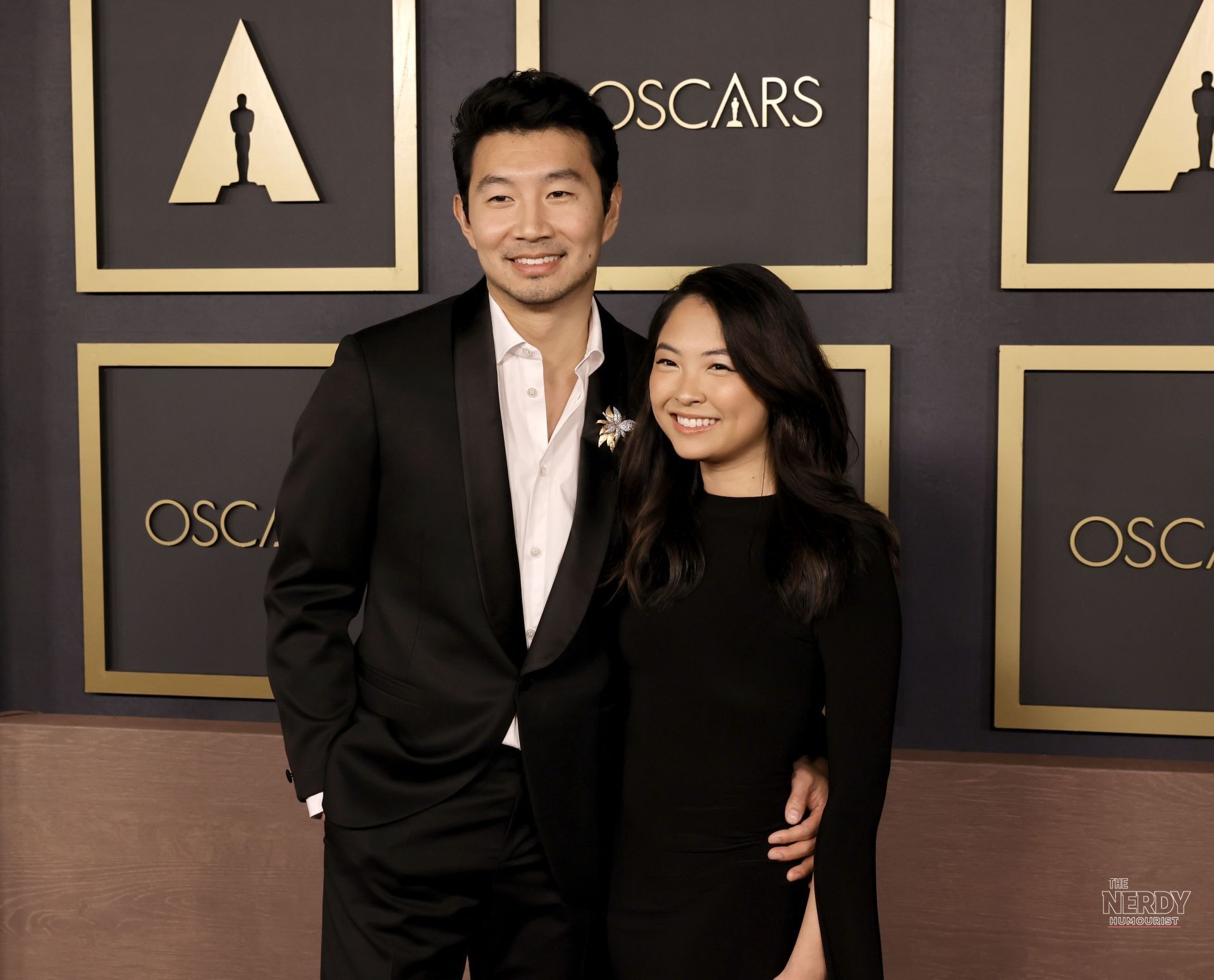 Simu Liu and Allison Hsu posing together on the Oscars red carpet — the couple whose Simu Liu wedding France Allison Hsu news broke Oct. 5