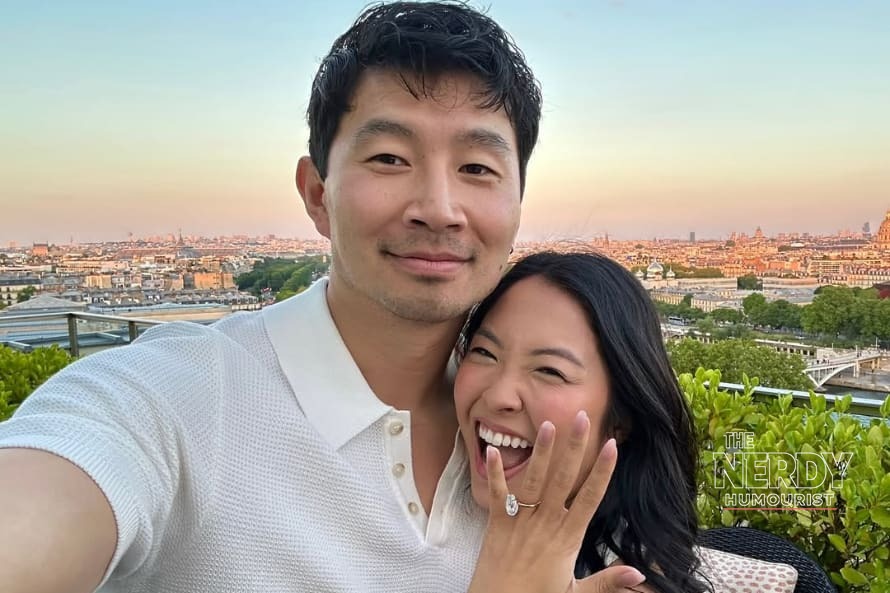 Simu Liu and Allison Hsu smiling in a Paris engagement photo after the Simu Liu wedding France Allison Hsu celebrations