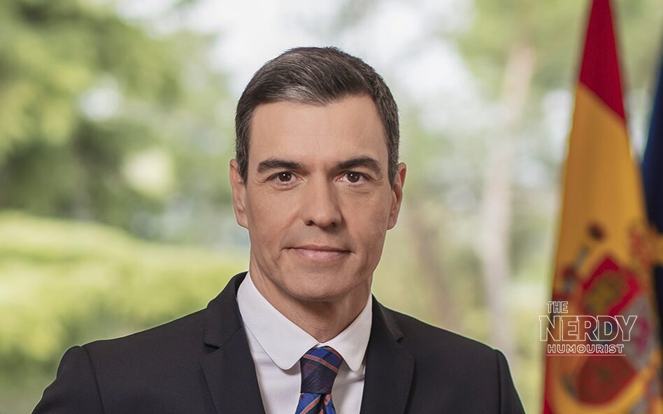 Spanish Prime Minister Pedro Sánchez in an official portrait, with the Spanish flag behind him