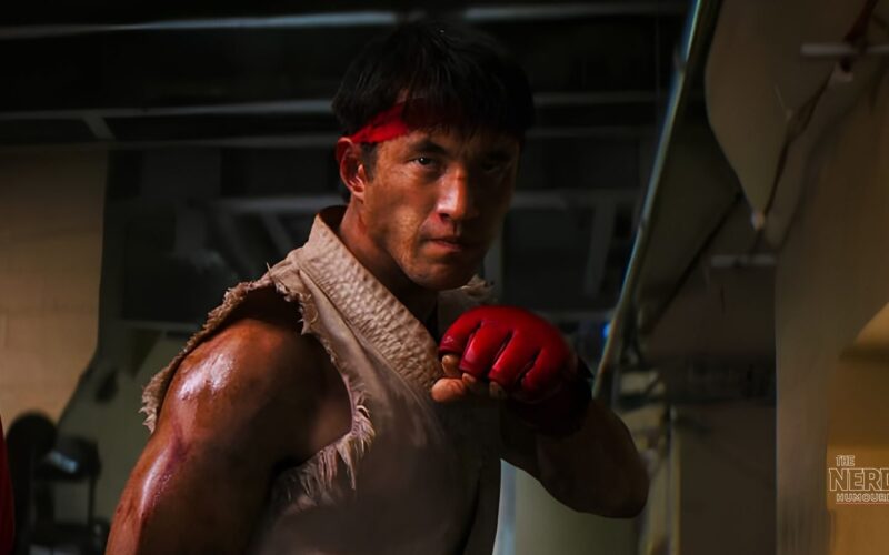 Andrew Koji as Ryu, battered and bloodied with his red headband, in a fight scene from the 2026 Street Fighter movie, as Street Fighter movie reviews split critics on release day