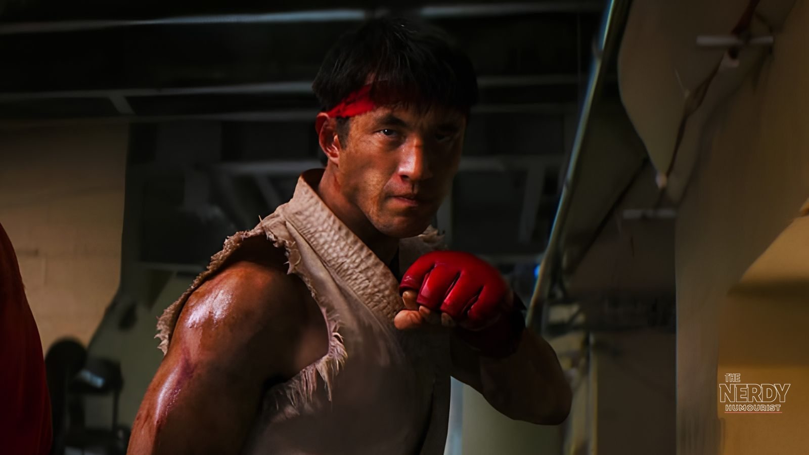 Andrew Koji as Ryu, battered and bloodied with his red headband, in a fight scene from the 2026 Street Fighter movie, as Street Fighter movie reviews split critics on release day
