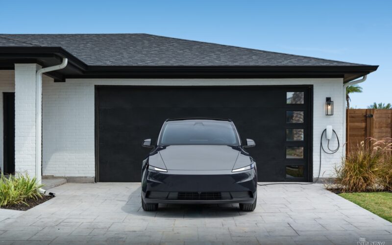 2026 Tesla Model Y charging at a home Wall Connector — Tesla Powershare home backup compatible setup