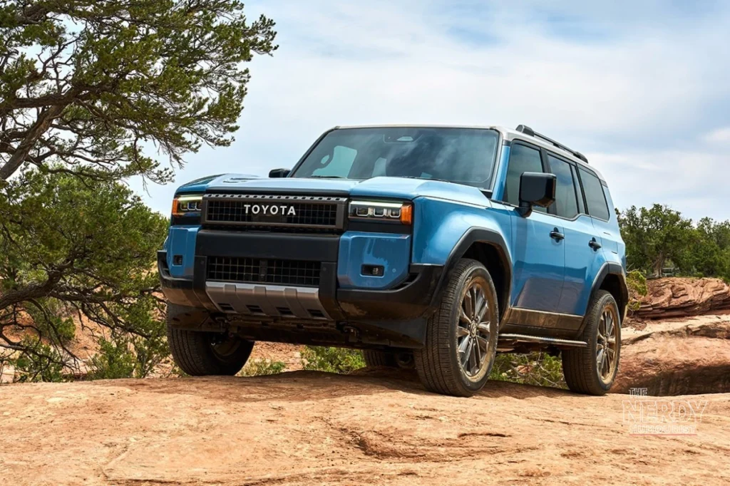 2025 Toyota Land Cruiser Hybrid on off-road terrain — subject of Toyota's Land Cruiser recall over fire risk