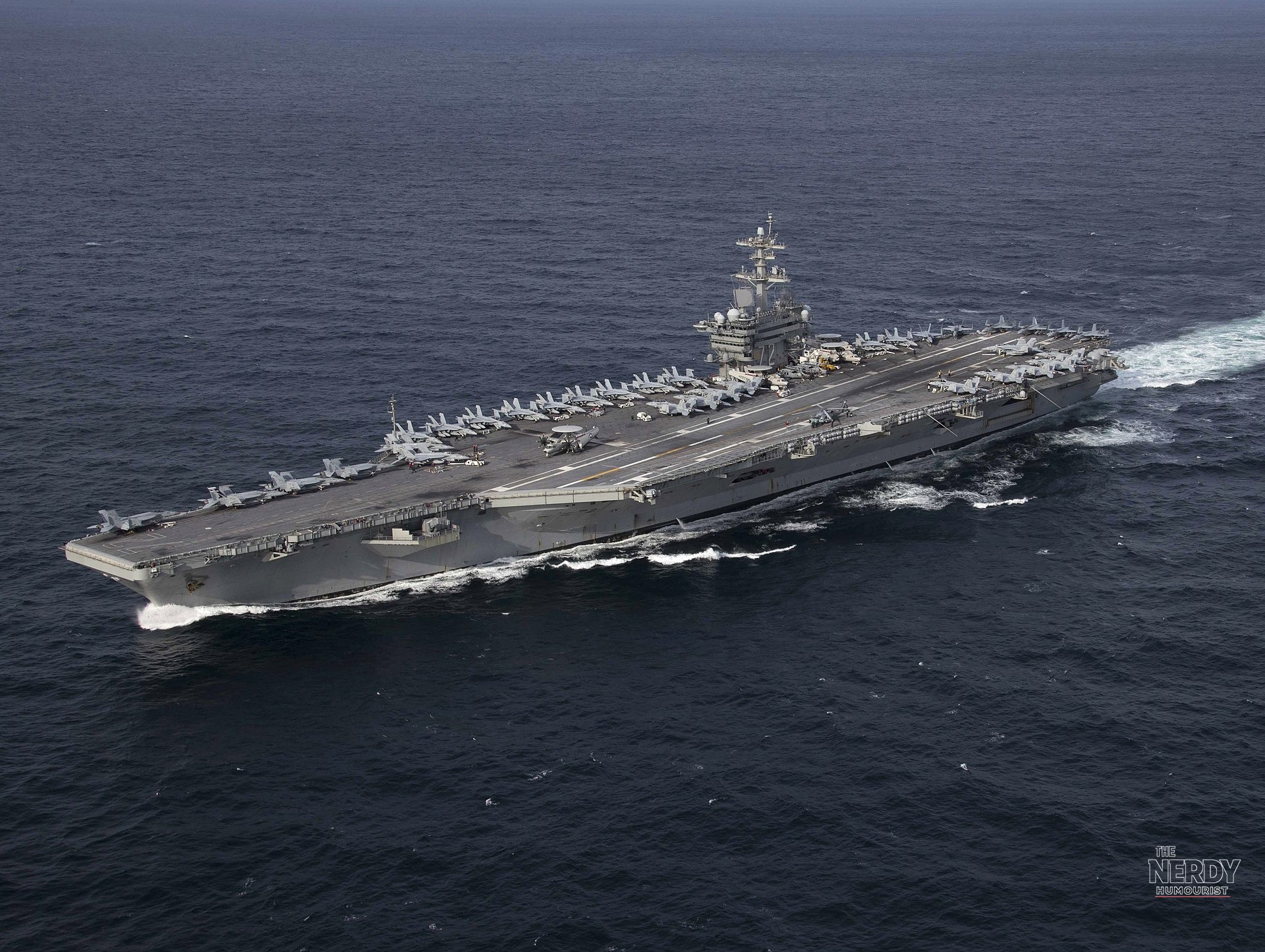 The USS Abraham Lincoln underway — the carrier earned the Presidential Unit Citation after a record 265-day deployment