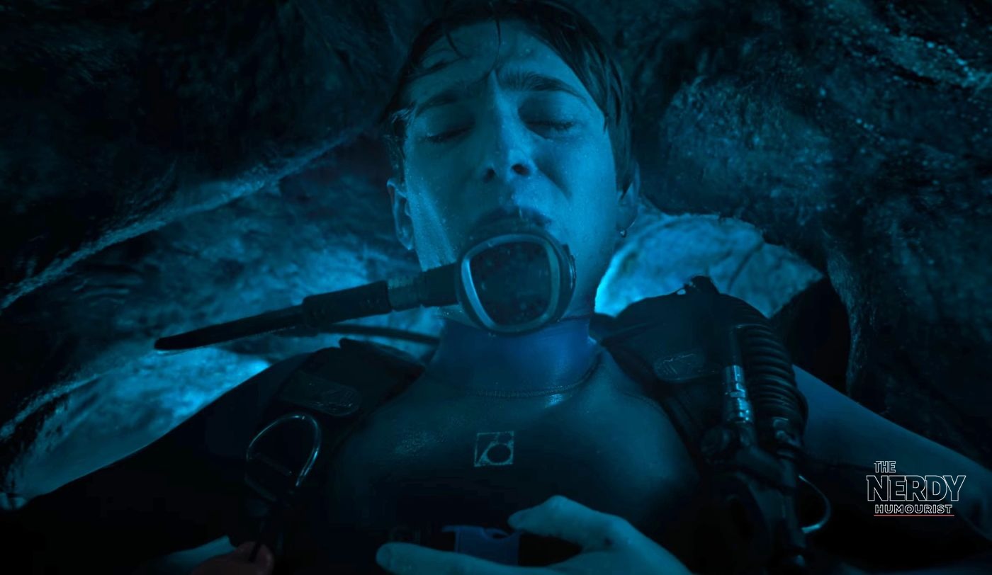 Austin Abrams as Jay Gardiner underwater in scuba gear in a dark, claustrophobic scene from the Whalefall movie